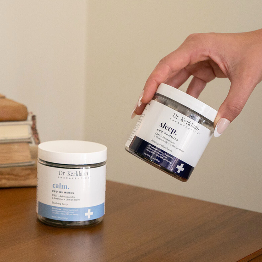 Dr. Kerklaan Calm and Sleep CBD Gummies shown together on a nightstand, representing the Day + Night Combo Pack for daily calm and restful sleep.