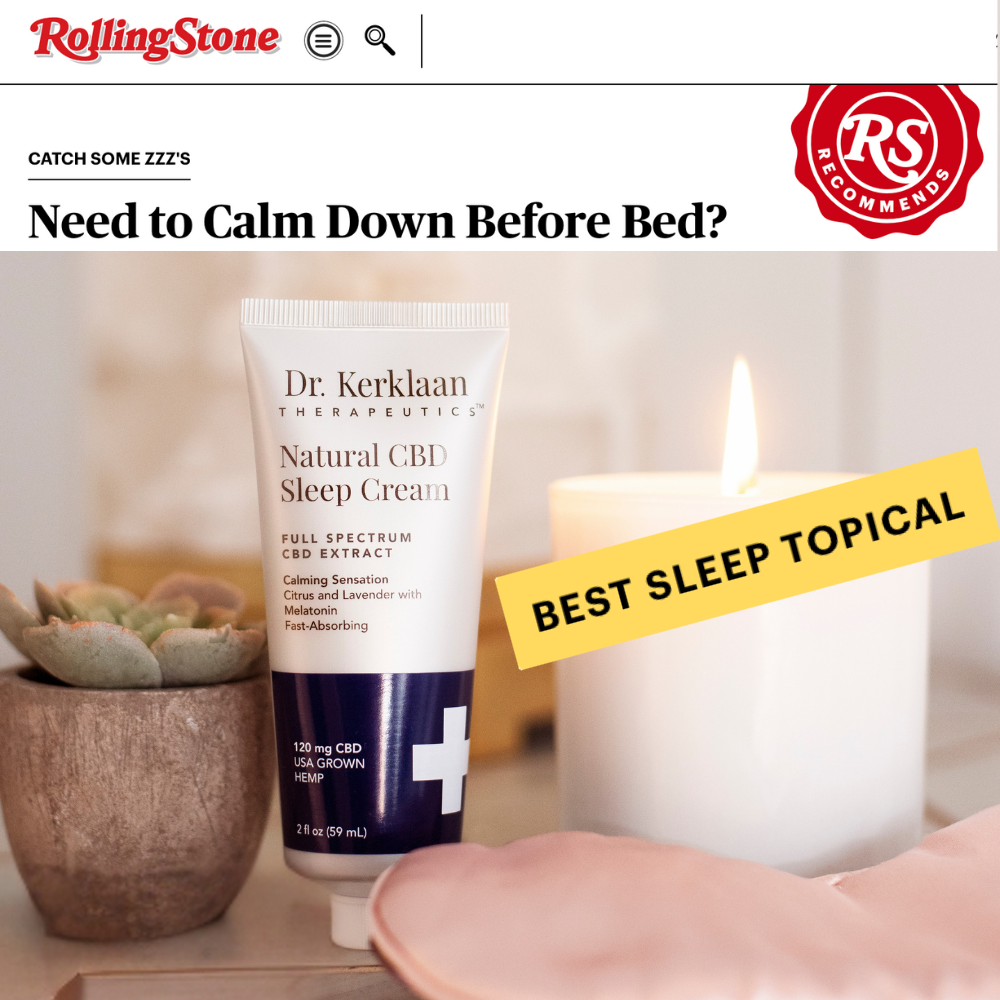 Dr. Kerklaan Natural CBD Sleep Cream featured in a Rolling Stone article with a ‘Best Sleep Topical’ badge, placed beside a candle and silk sleep mask.